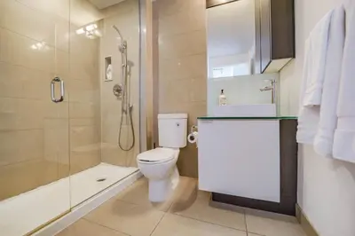 a bathroom with a toilet and a shower at RHD Luxury Condos-Downtown, CN Tower, Metro Toronto Convention Centre, Rogers Centre, Free Parking in Toronto