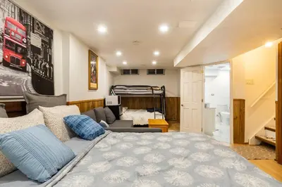 a bedroom with a bed and a living room at BIG Oasis Studio near Airport YYZ in Toronto