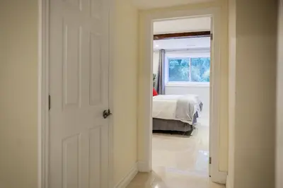 a door leading to a bedroom with a bed at Nature Oasis BarMar 2BR Suite in Dundas close to Webster Falls in Dundas
