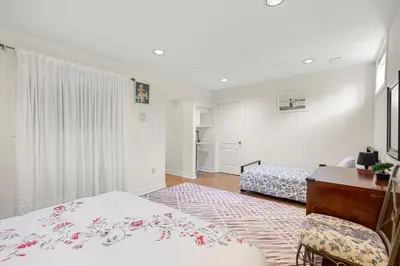 a bedroom with a bed and a desk and a chair at Home Away From Home in Richmond Hill