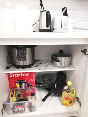 a kitchen shelf with a coffee pot and food at Perfect location comfort private house lower level 2 bedroom unit in Mississauga