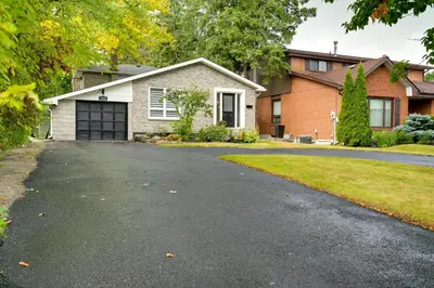 a driveway in front of a house at Furnished Family Home near Toronto - Great Location Game Room - Backyard - Parking & Self Checkin in Pickering