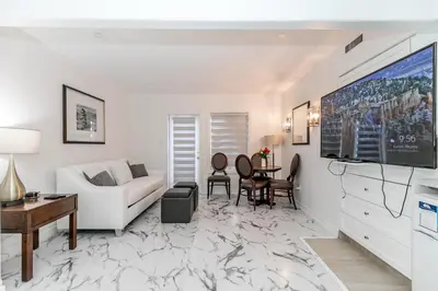 a living room with a white couch and a table at Carriage Hills Retreat Rental in Edgar