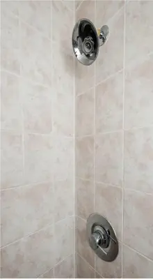 a shower with a shower head in a bathroom at Toronto Downtown Core Two Bedroom Condo with CN Tower View, Free Parking in Toronto