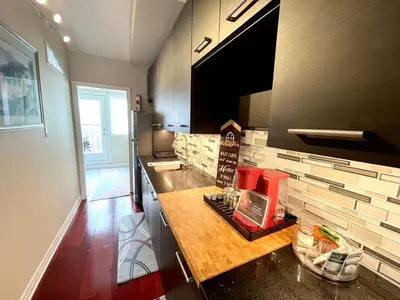 a kitchen with a counter top in a room at Stunning Rooms in Townhouse across the Beach in Toronto