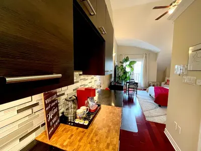 a living room with a table with food on it at Stunning Rooms in Townhouse across the Beach in Toronto