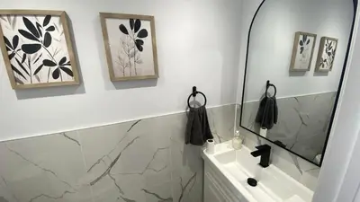 a bathroom with a mirror and a sink at Spectacular 3 BR 2 WR House - Close to Airport in Toronto