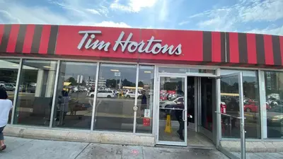 a tim hortons store with the doors open at Spectacular 3 BR 2 WR House - Close to Airport in Toronto