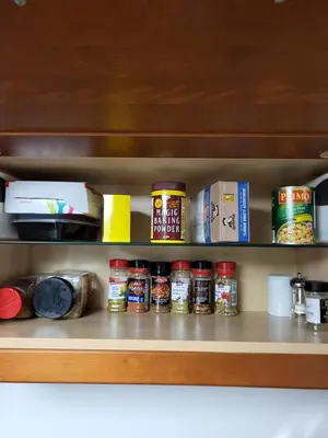 a pantry shelf with lots of food items on it at Cozy Suite with HOT TUB & Highspeed Internet in Grimsby