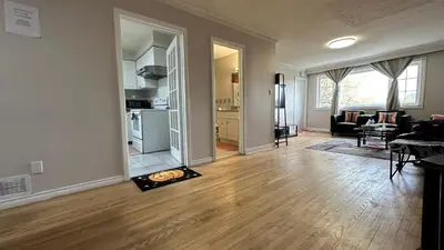 an empty living room with a fire in the middle of the room at Full Privacy Apartment with Free Parkrings in Toronto