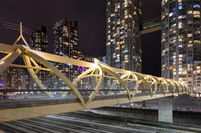 a bridge in a city at night with tall buildings at Lovely 2 Bed Condo in Downtown Toronto in Toronto