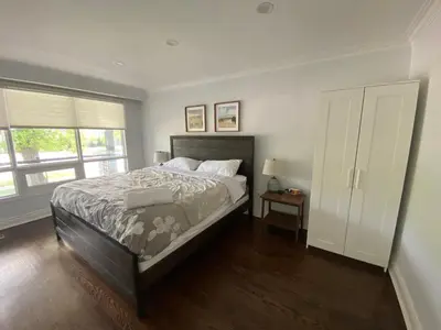 a bedroom with a large bed and a window at Yonge and Finch Subway !L Spacious & Bright Private Bedroom with Shared Amenties in Toronto