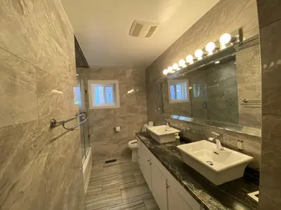 a bathroom with two sinks and a mirror at Yonge and Finch Subway !P Cozy & Quiet Private Bdr with Private Bathroom in Toronto