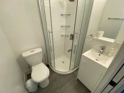 a bathroom with a shower and a toilet and a sink at Yonge and Finch Subway !P Cozy & Quiet Private Bdr with Private Bathroom in Toronto