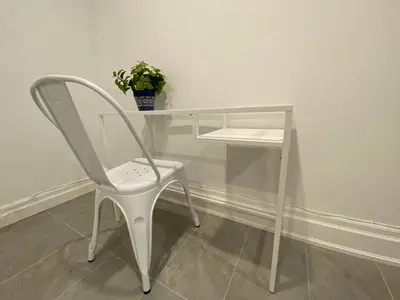 a white desk with a chair and a potted plant at Yorkmills and Bayview !B Spacious and Stylish Private Bdr with Shared Bathroom in Toronto