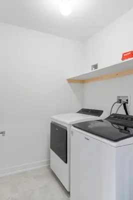a white kitchen with a stove and a dishwasher at Jewel of Blue Mountain - Walk to Ski and Village - EV plug in Blue Mountains