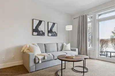 a living room with a couch and a table at Blue Mountain Retreat at Rivergrass in Blue Mountains