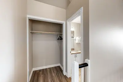 a bathroom with a closet with a mirror at Condo 916 at North Creek Resort in Blue Mountains
