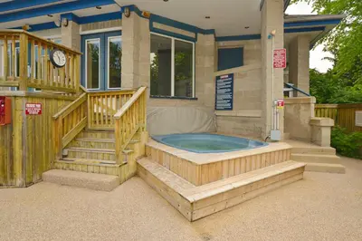 a house with a jacuzzi tub in the backyard at Condo 916 at North Creek Resort in Blue Mountains