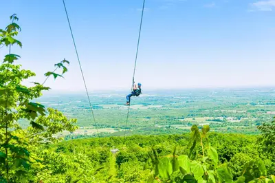 a man on a zip line in the jungle at Condo 916 at North Creek Resort in Blue Mountains