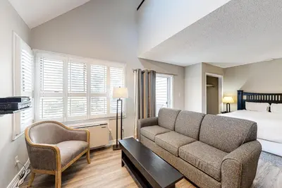 a living room with a couch and a bed at Condo 916 at North Creek Resort in Blue Mountains