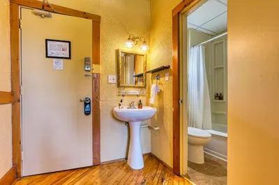 a bathroom with a sink and a toilet at The Stratford Hotel by Hoco Hotels Collection in Stratford