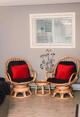 two chairs with red pillows in a living room at Sun Chaser Bay in Carrying Place