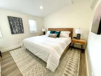 a bedroom with a bed and a table with a nightstand at 