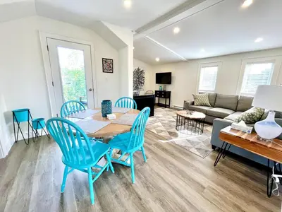 a living room with a table and chairs and a couch at 