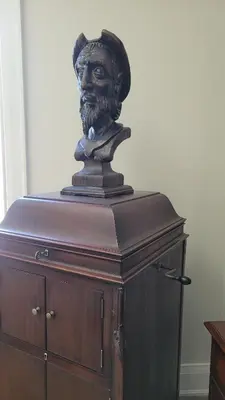 a bust of a man on top of a wooden cabinet at Private Suite in Forest Hill with full kitchen and parking in Toronto
