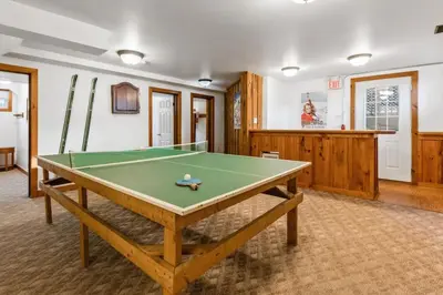 a living room with a pool table in it at Large Chalet for up to 16 ppl close to mountains in Blue Mountains