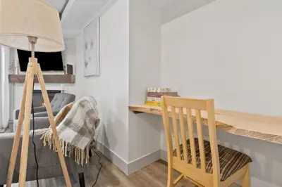 a dining room with a chair and a table at Four Peaks - Unit 40A in Collingwood