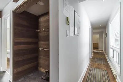 a hallway with wood paneling in a house at Panoramic-Blue Mountain-Balcony-Sauna-Backyard-King in Blue Mountains