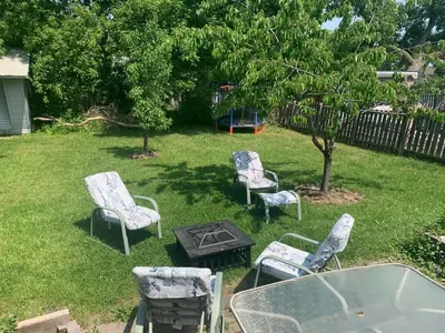 a group of chairs and a table in a yard at Mama Gol in Richmond Hill