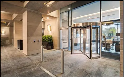 a lobby with a revolving door in a building at Traveller home in centre Toronto in Toronto