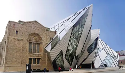 a large brick building with a glass facade at Luxury Condo on Bay Street in Toronto