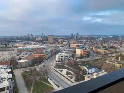 an aerial view of a city with buildings and roads at Cozy 1BR Condo w/ Insuite LDRY, Gym & Free Parking in Waterloo