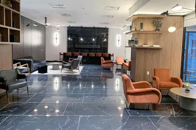 a lobby with chairs and a waiting room at Cozy 1BR Condo w/ Insuite LDRY, Gym & Free Parking in Waterloo