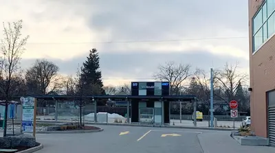 a gas station with a sign on top of it at Cozy 1BR Condo w/ Insuite LDRY, Gym & Free Parking in Waterloo