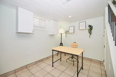 a table in a room with a white wall at The Newark House in Niagara on the Lake