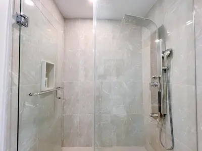 a shower with a glass door in a bathroom at Spacious Rooms with Bath Near Wonderland & Vaughan Mills Mall in Vaughan