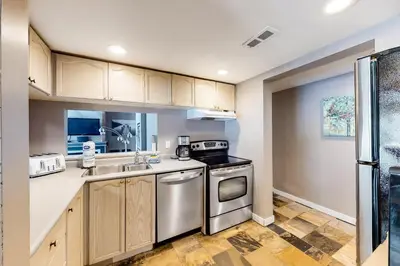 a kitchen with a sink and a stove at Wintergreen 116 in Blue Mountains