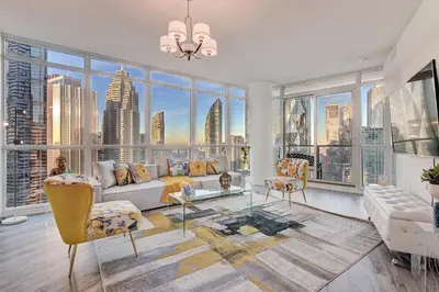 a living room with a view of the city at Stunning 2 BD in heart of Toronto with Parking in Toronto