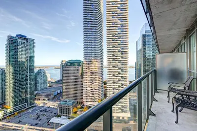 a balcony with a view of a city at Stunning 2 BD in heart of Toronto with Parking in Toronto
