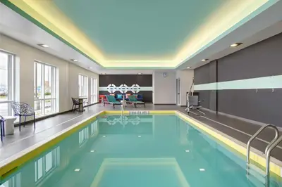 a large swimming pool in a hotel room at Tru By Hilton Toronto Airport West in Mississauga