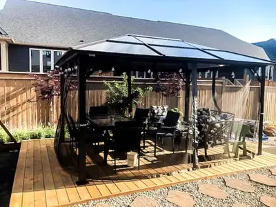 a gazebo with a table and chairs on a patio at Inspired Stay close to Niagara *4B & 2King Beds* in Thorold
