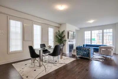 a living room with a couch and a table and chairs at Your Perfect Getaway Master Bedroom in Bradford