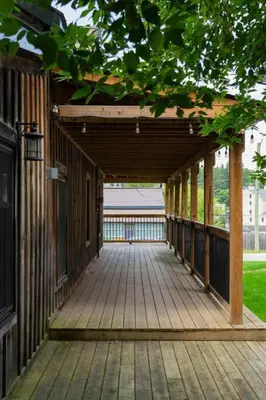 a wooden walkway leading to a building at Elegant Elora Home with Stylish Décor in Elora